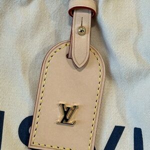 Louis Vuitton Cream Luggage Tag from High Rise